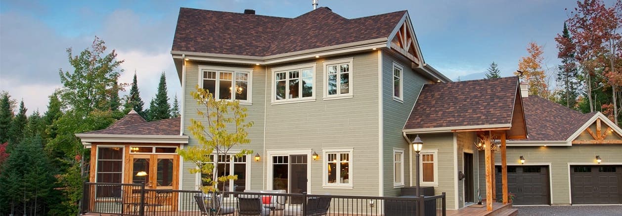 Ridgewood D-5™ CanExel engineered wood siding on a home exterior — Dutch lap profile in Acadia