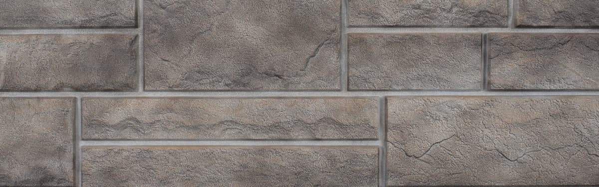 NovikStone PHC Premium Hand-Cut Stone polymer panels in shadow gray on home exterior
