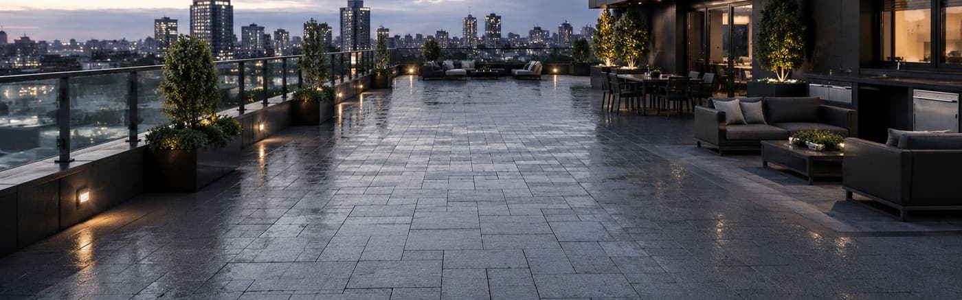Pro Materials SmartPave Roof Pavers installed on a luxury rooftop terrace with city skyline view